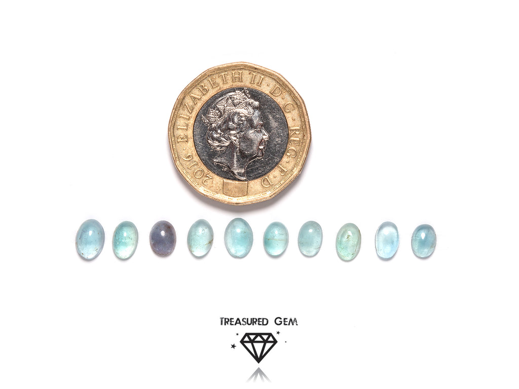loose fluorite cabochons in oval shapes close up